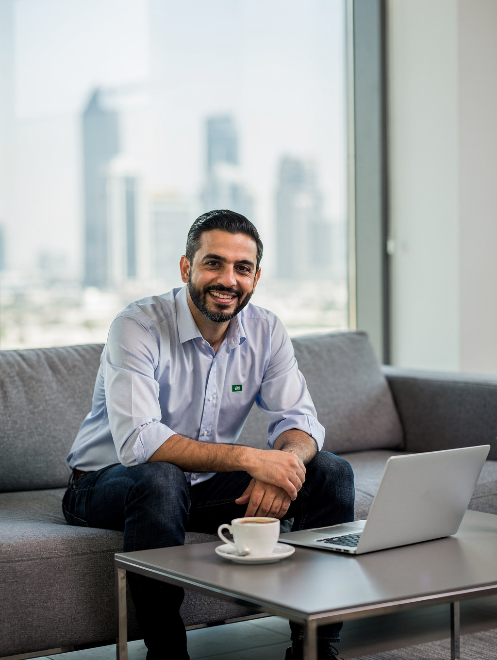 Professional coach wearing formal Saudi thobe and igal